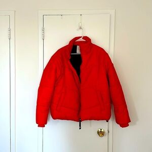 Uniqlo hot orange puffer. Warm and gently used. Some signs of wear.